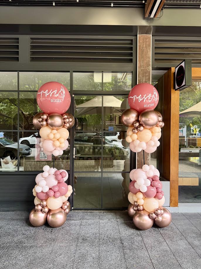 2 metre organic balloon columns with custom brand colours and company logo for corporate events and activations”