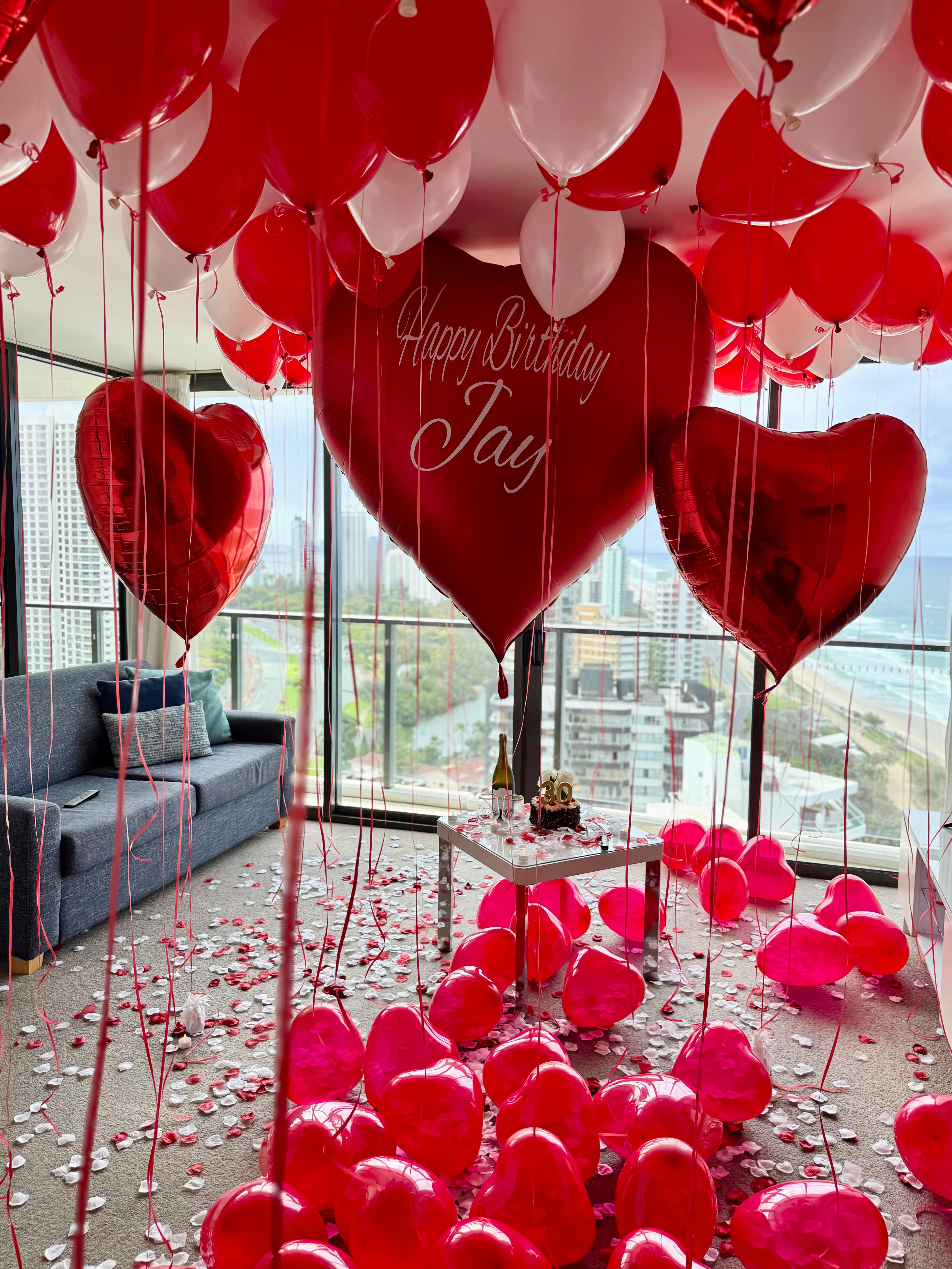 Hotel room surprise setups in Brisbane & Gold Coast with romantic balloons, florals, and personalised styling for unforgettable moments.